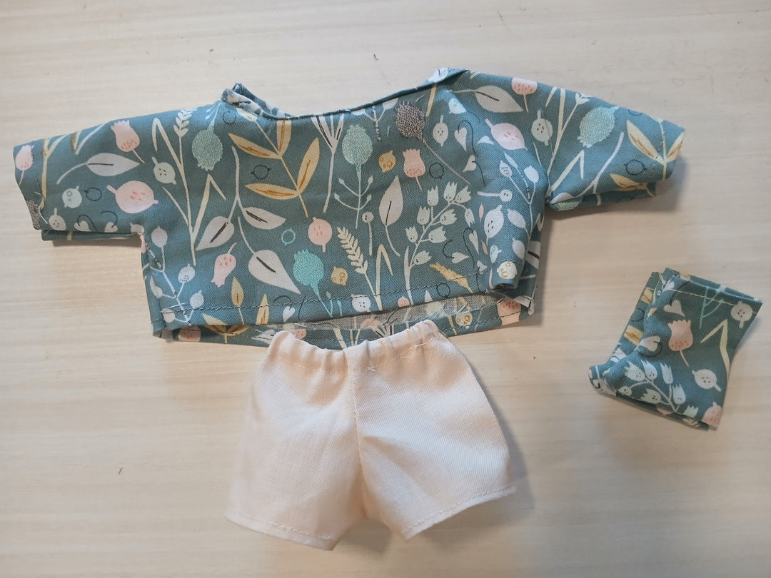 long-sleeved blouse, shorts, and booties