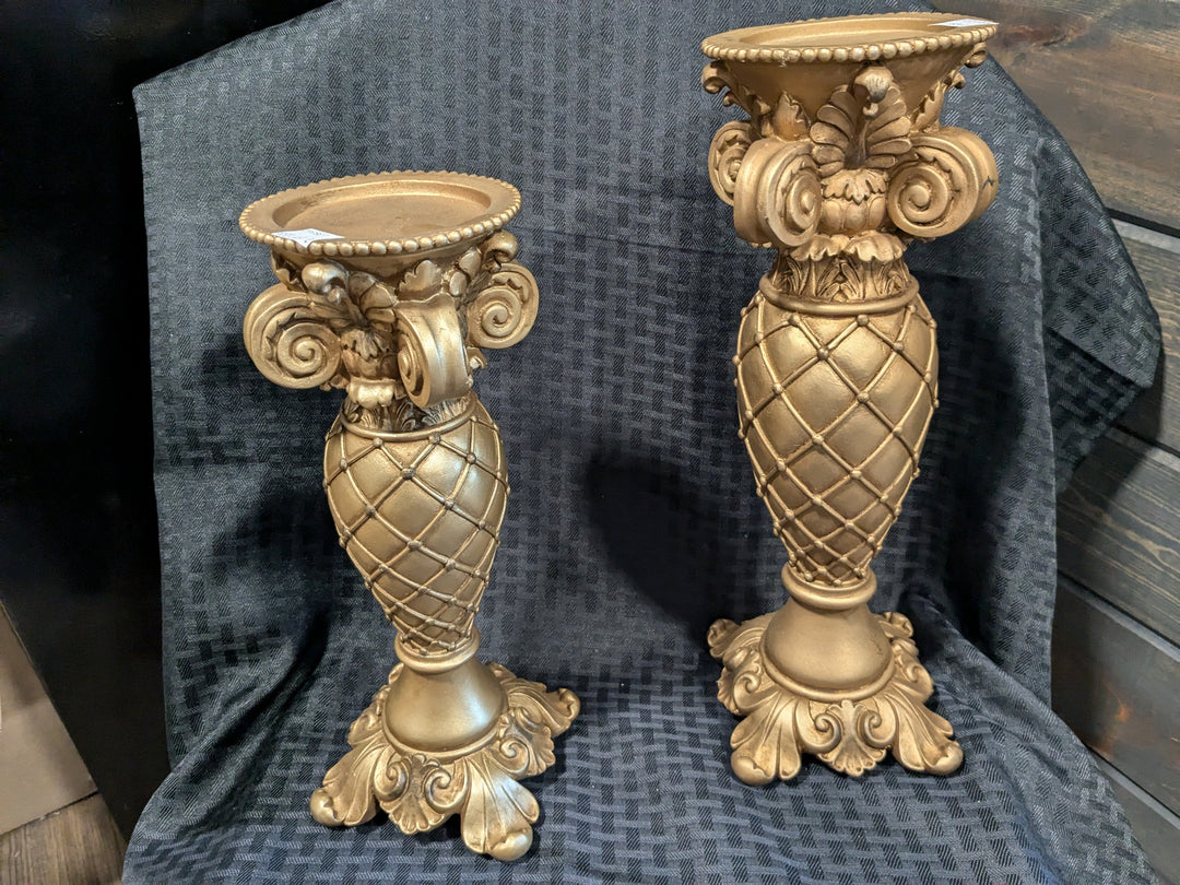 Aged Gold Candleholder – an elegant and vintage-inspired candleholder featuring a distressed gold finish, perfect for adding a touch of sophistication to your home decor. Ideal for candles, centerpieces, and accenting any room.