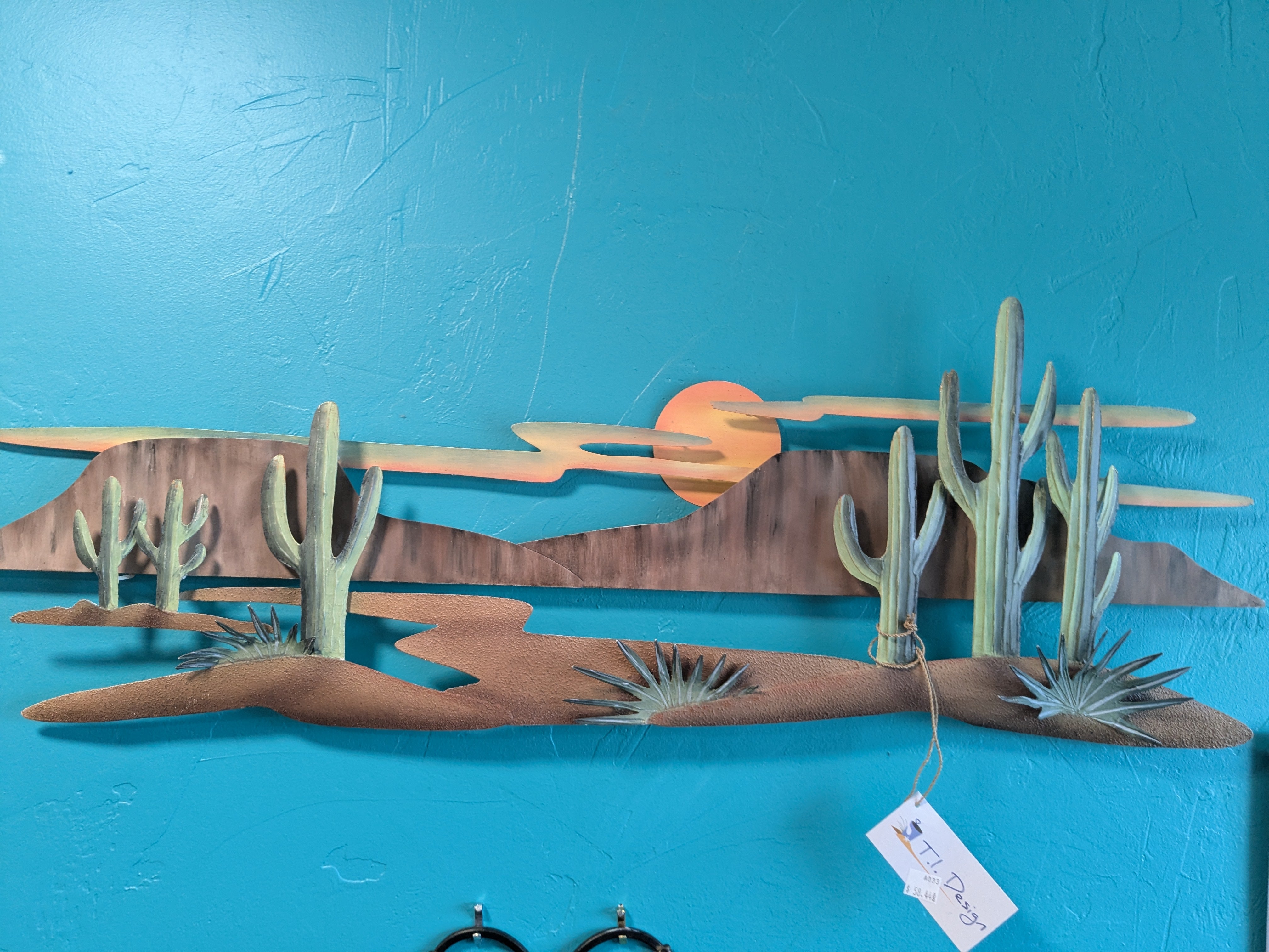 Cactus Landscape 3-D Metal Wall Art – Stunning three-dimensional wall decor featuring a vibrant cactus landscape. Perfect for southwestern or desert-themed home decor, this unique metal art piece adds depth and style to any room.