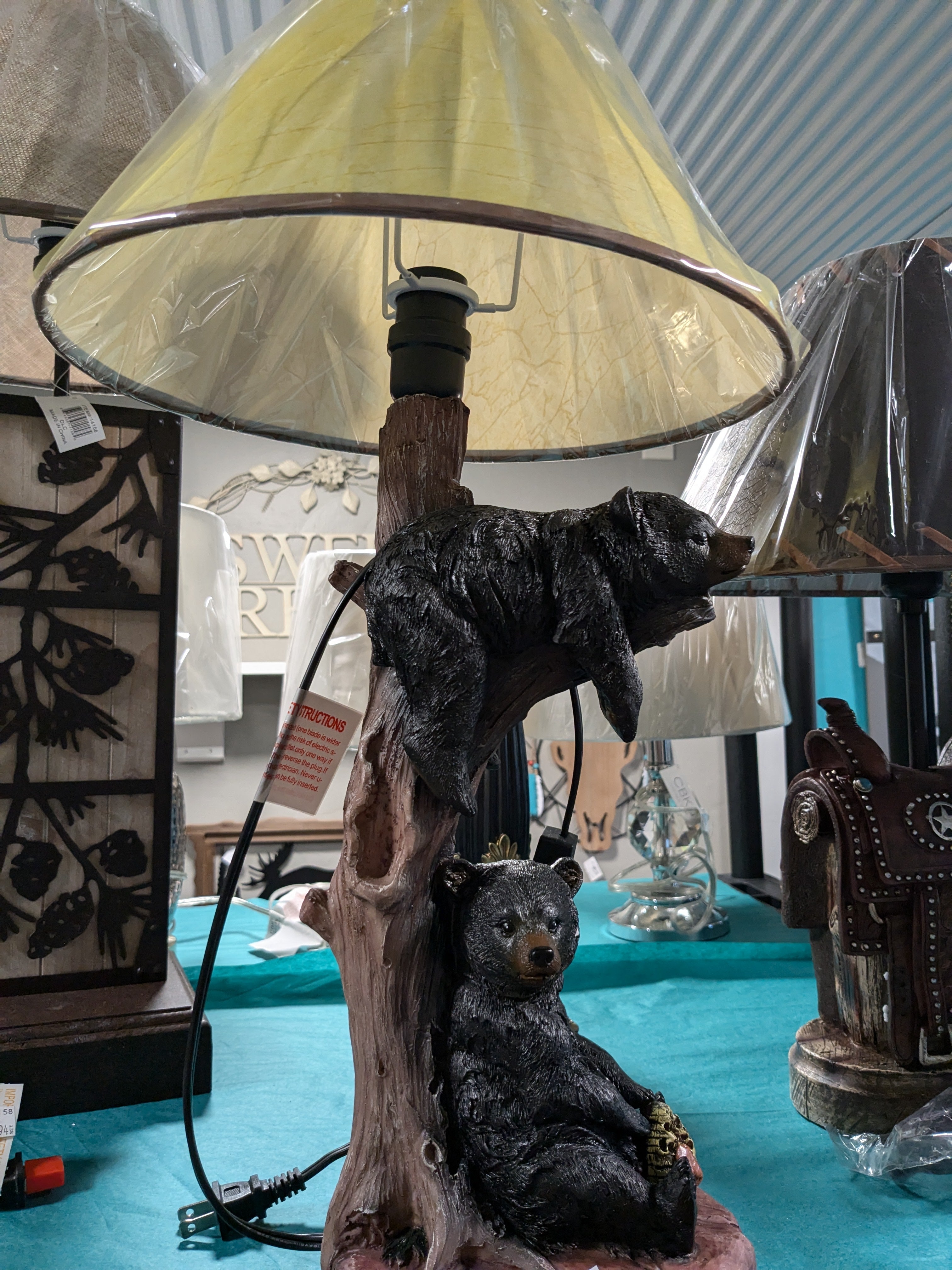 Black Bear Hanging Table Lamp – a charming lamp featuring a black bear design, perfect for adding a rustic touch to your decor. Ideal for use on tables, nightstands, or desks, this unique lamp enhances cabin or nature-themed interiors