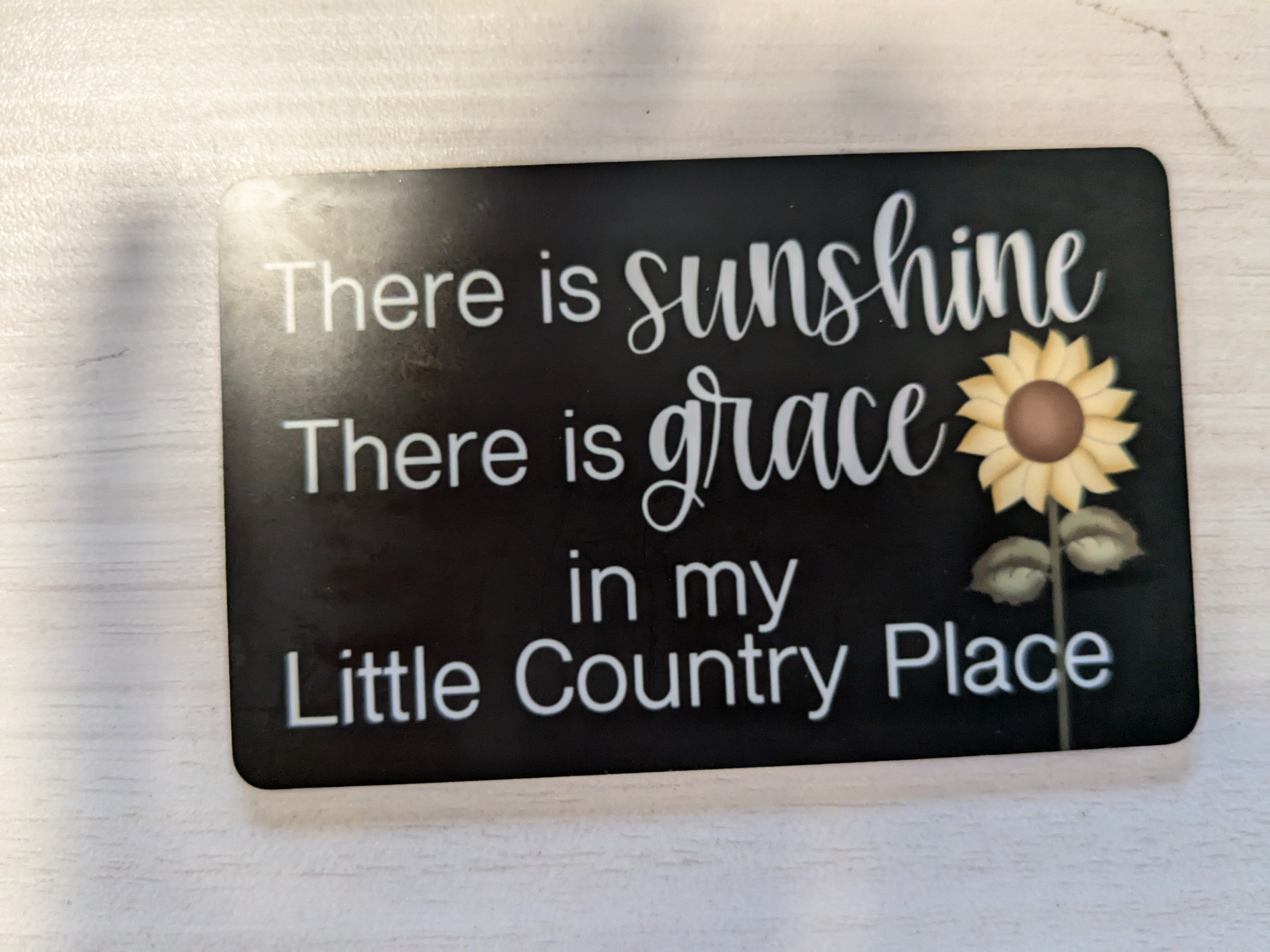 There is sunshine, there is grace...' plaque – a beautifully designed fall sign featuring an engraved inspirational message with white pumpkin and orange pumpkin plaid accents. This readymade craft adds a cozy, rustic touch to your autumn decor