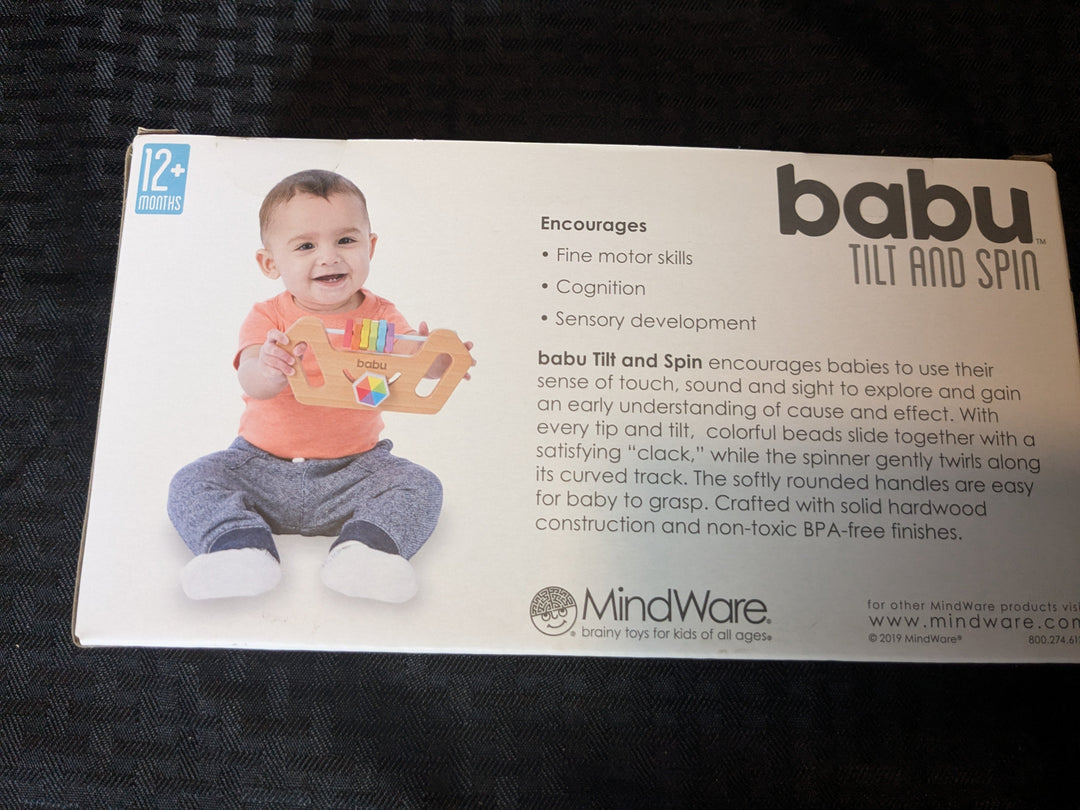 Babu Tilt and Spin – an interactive toy designed for infants, featuring vibrant colors that promote sensory development and motor skills as babies tilt and spin the toy for engaging play.