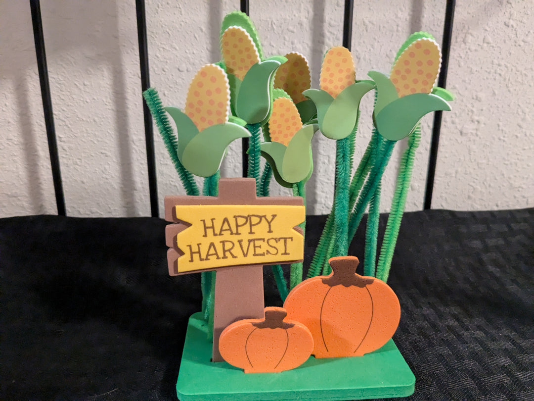 Happy Harvest' readymade craft decor block – engraved wood block with orange pumpkin and plaid design. Rustic painted photo frame perfect for fall and Thanksgiving decor, ideal for displaying family photos or seasonal decorations.